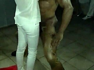 Muscular Dominican dancer's striptease with blades