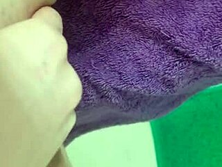 HD porn of a teen wetting herself on a towel