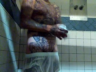 Hardcore shower scene with a tattooed white guy and his big cock