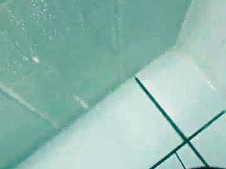 Brazilian hottie takes a messy cumshot in the bath