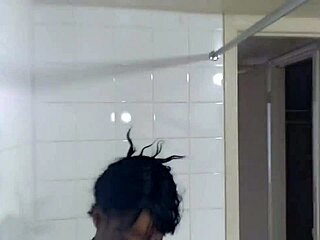 Ebony MILF enjoys a steamy shower and rough sex