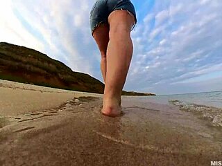 Explore the sandy shores with my bare feet