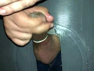 A man visits a swingers' home to masturbate at a glory hole